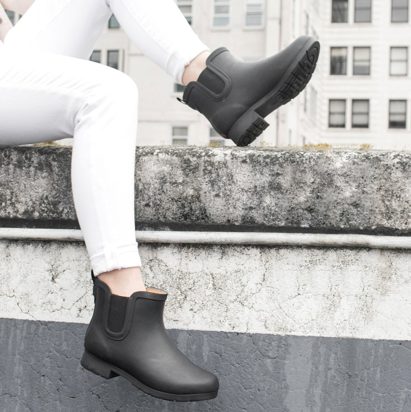 Person wearing the Delridge Faux Fur Chelsea Rain Boot - Black